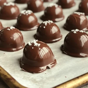 You need 1 cup of roasted espresso beans. These beans give the snack a strong coffee taste. They also add a nice crunch. Use 1 cup of dark chocolate chips with 70% cocoa. This chocolate brings rich flavor. It pairs well with the espresso beans for a great taste. Add 1 tablespoon of coconut oil. This oil helps the chocolate melt smoothly. It also adds a light coconut flavor to the mix. A pinch of sea salt is great for sprinkling. It balances the sweetness of the chocolate. This small touch makes each bite even better. These four simple ingredients create a delightful treat. Combining them gives you a crunchy, sweet, and salty snack. The flavor pairs well with coffee or as a quick boost. First, grab a baking sheet. Line it with parchment paper. This makes it easy to lift off the beans later. Make sure the paper is smooth. Any bumps can cause the chocolate to stick. Next, take a microwave-safe bowl. Add 1 cup of dark chocolate chips and 1 tablespoon of coconut oil. The oil helps the chocolate melt smoothly. Heat the bowl in the microwave. Set it to 30 seconds and stir after each round. This should take about 1 to 2 minutes. Once melted, let the chocolate cool for one minute. Now, add 1 cup of roasted espresso beans to the melted chocolate. Stir gently. You want each bean to be covered well. Use a fork or slotted spoon to scoop them out. Place each bean on the lined baking sheet. While the chocolate is soft, sprinkle a little sea salt on top. This adds a nice flavor! Put the baking sheet in the fridge for about 30 minutes. This will let the chocolate harden. Once set, check for clumps. Break them apart if needed. Transfer the beans to an airtight container for storage. Enjoy your tasty treat anytime! To make great chocolate-covered espresso beans, start with high-quality beans. Look for freshly roasted espresso beans. They should be dark and shiny. Try to find beans that smell rich and bold. A good flavor is key to making your treat shine. You might want to choose beans from a local roaster. This way, you can get fresh beans that taste amazing. For melting chocolate, I suggest using dark chocolate chips with 70% cocoa. These chips melt well and taste rich. Use a microwave-safe bowl for easy melting. Heat the chocolate in 30-second bursts. Stir after each round to get a smooth texture. If you want a glossy look, add a tablespoon of coconut oil. This will help the chocolate stay silky and shiny. To avoid clumping, make sure your chocolate is smooth before adding the beans. Stir gently when coating the beans so every bean gets a nice layer. Use a fork or slotted spoon for easy lifting. This way, you can let excess chocolate drip off. Place the coated beans on your parchment-lined baking sheet without crowding them. This helps each bean stay separate and look good. {{image_2}} You can change the flavor by using different types of chocolate. Milk chocolate gives a sweet taste. White chocolate adds a creamy touch. Each type of chocolate changes how the beans taste. Try them all to find your favorite! Adding flavorings can make your beans unique. A splash of vanilla extract gives a warm hint. Almond extract adds a nutty twist. Just a little goes a long way. Mix in the flavor before adding the beans to the chocolate. For a spicy kick, add cayenne pepper. This adds heat to the sweet chocolate. Just a pinch is enough to make a big difference. It creates a fun contrast with the smooth chocolate and bold espresso. This variation is perfect for those who love a little adventure in their snacks! Chocolate-covered espresso beans pack a great punch of taste and nutrition. In one serving of about 1 ounce, you get: - Calories: 150-200 - Fiber: 2 grams - Protein: 3 grams - Fat: 9 grams This snack combines healthy fats from coconut oil and the rich flavor of dark chocolate. Dark chocolate is rich in antioxidants. These help protect your body from damage. It may also improve heart health by boosting blood flow. A study shows 70% cocoa chocolate can lower blood pressure. Espresso adds a nice caffeine boost. Caffeine can improve focus and energy. It also may enhance your mood. While espresso beans are tasty, they can have some side effects. Too much caffeine can lead to jitters or trouble sleeping. Some people may feel anxious if they consume a lot. It’s best to enjoy these beans in moderation. If you’re not used to caffeine, start slow. You can find chocolate-covered espresso beans at most grocery stores. Look in the snack aisle or near coffee products. They are also sold at specialty coffee shops. For a wider selection, try online retailers like Amazon or specialty food websites. Homemade chocolate-covered espresso beans last about two weeks when stored properly. Keep them in an airtight container to maintain freshness. If you want them to last longer, you can keep them in the fridge. This will help them stay crisp and tasty. Yes, you can use sugar-free chocolate for this recipe. Just make sure it melts well. Sugar-free chocolate can give a different flavor but still tastes great. You can enjoy your snack with fewer calories if you choose this option. The best way to store chocolate-covered espresso beans is in an airtight container. Keep them in a cool, dry place, away from direct sunlight. This will help keep them fresh and crunchy. If you live in a hot area, the fridge can also be a good choice. You can make chocolate-covered espresso beans without coconut oil. The oil helps the chocolate melt smoothly and coat the beans better. If you skip it, use a high-quality chocolate that melts well. You may need to adjust the melting time to get the right texture. This guide covered how to make chocolate-covered espresso beans. You learned about ingredients like roasted espresso beans, dark chocolate, and coconut oil. I shared step-by-step instructions and essential tips to enhance your results. Variations let you customize flavors and explore new twists. The nutritional info shows health benefits and possible effects of espresso beans. Now, you have the tools to create delicious treats at home. Enjoy making your unique snacks!