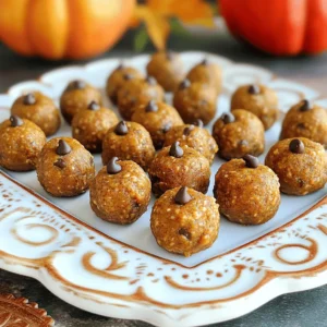 When making Pumpkin Spice Energy Bites, the right ingredients matter. Here’s what you need to gather: - 1 cup rolled oats - 1/2 cup natural peanut butter or almond butter - 1/2 cup pure pumpkin puree - 1/4 cup honey or maple syrup - 1 teaspoon vanilla extract - 1 teaspoon pumpkin pie spice - 1/2 teaspoon cinnamon - 1/4 cup mini chocolate chips or chopped nuts (optional) - A pinch of salt These ingredients blend well to create a tasty and healthy snack. The rolled oats give a great base, while the nut butter adds protein. Pumpkin puree brings moisture and flavor, making these bites soft and delicious. Honey or maple syrup sweetens the mix, and vanilla extract adds warmth. The spices—pumpkin pie spice and cinnamon—create that cozy fall flavor. You can also add chocolate chips or nuts for fun textures. Remember, you can adjust the amounts based on your taste. Enjoy selecting these fresh, wholesome ingredients for your energy bites! 1. In a large mixing bowl, combine 1 cup of rolled oats, 1/2 cup of pumpkin puree, and 1/2 cup of natural peanut butter or almond butter. 2. Next, add in 1/4 cup of honey or maple syrup, 1 teaspoon of vanilla extract, 1 teaspoon of pumpkin pie spice, 1/2 teaspoon of cinnamon, and a pinch of salt. 3. Mix everything together until you see a sticky dough form. This dough is the heart of your energy bites. 1. Using your hands, scoop out small amounts of the mixture, about 1 tablespoon each. Roll these into bite-sized balls. 2. Place the balls onto a parchment-lined baking sheet. This keeps them from sticking. 3. Refrigerate the bites for at least 30 minutes to help them firm up. 4. After chilling, transfer the energy bites into an airtight container. Store them in the fridge. Enjoy them for up to one week. To make the best Pumpkin Spice Energy Bites, get the mixture sticky. This stickiness helps you roll them into balls. If it feels dry, add a bit more nut butter or pumpkin puree. For sweetness, taste the mix. You can adjust it by adding more honey or maple syrup. If your bites turn out too soft, chill them longer. A little extra time in the fridge will help them firm up nicely. Presentation matters! Serve your energy bites on a decorative platter. It makes them look fancy and fun. To add flair, sprinkle some extra cinnamon or pumpkin pie spice on top. This simple touch makes them even more appealing. You can also use small paper cups for serving. They look cute and are easy to grab. {{image_2}} You can easily change up the taste of your energy bites. Here are some ideas: - Use different nut butters: Try almond or cashew butter for a new flavor. - Add dried fruits or seeds: Raisins, cranberries, or chia seeds boost nutrition. - Experiment with spices: Nutmeg or ginger can bring a nice twist to the bites. If you follow specific diets, you can make these bites work for you: - Make them vegan: Replace honey with maple syrup for a plant-based option. - Gluten-free options: Use certified gluten-free oats to keep it safe for gluten-free diets. With these variations, you can enjoy delicious Pumpkin Spice Energy Bites tailored to your taste or dietary needs! To keep your Pumpkin Spice Energy Bites fresh, store them in an airtight container in your refrigerator. This method locks in moisture and flavor, so they're ready to enjoy whenever you want. If you want to save some for later, you can store them in the freezer. Just make sure to place them in a freezer-safe bag or container to avoid freezer burn. These delightful bites will stay fresh for up to one week in the refrigerator. Be sure to check them for any signs of spoilage before enjoying. If you freeze your bites, you can enjoy them for a longer period. When you're ready to eat, simply thaw them at room temperature. This keeps their texture and flavor just right! Pumpkin Spice Energy Bites can last for a week in the fridge. Store them in an airtight container to keep them fresh. If you want them to last longer, freeze them. In the freezer, they can last for up to three months. Just make sure to thaw them at room temperature before eating. You should not use pumpkin pie filling. It has added sugar and spices, which change the taste. Pure pumpkin puree is better because it gives you full control over the flavor. This way, you can adjust the spices to your liking. Yes, these bites are healthy! Here’s why: - Oats are full of fiber and keep you full longer. - Pumpkin puree is low in calories and packed with vitamins. - Nut butter adds healthy fats and protein. - Honey or maple syrup gives natural sweetness without refined sugar. - Cinnamon may help regulate blood sugar levels. These ingredients combine to make a nutritious snack that fuels your day! In this blog post, we explored how to make delicious Pumpkin Spice Energy Bites. We covered the key ingredients, simple steps for preparation, and helpful tips to perfect the recipe. You learned about flavor customizations and dietary alternatives, too. These bites not only taste great but also offer great nutrition. Enjoy making them as a quick snack or energy boost. Keep experimenting with your own variations for fun!