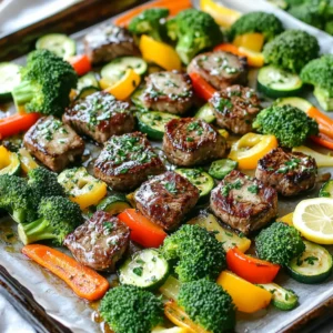- Sirloin steak details and preparation You need 1 pound of sirloin steak. Cut it into 1-inch cubes. Choose a fresh piece for the best flavor. - Vegetables selection and quantity Use 2 cups of broccoli florets. Add 1 sliced bell pepper, any color you like. Use 1 medium zucchini, sliced. Finally, include 1 cup of baby carrots for sweetness. - Garlic butter mixture components For the garlic butter, melt 4 tablespoons of unsalted butter. Mince 4 cloves of garlic to add strong flavor. - Seasoning and garnish specifics Add 2 teaspoons of dried Italian seasoning. Season with salt and black pepper to taste. Squeeze the juice of 1 lemon over the dish. Chop fresh parsley for garnish. Start by preheating your oven to 425°F (220°C). This helps the steak and veggies cook evenly. Next, grab a large sheet pan. Line it with parchment paper. This step makes cleanup a breeze later on. In a large mixing bowl, combine the melted butter, minced garlic, Italian seasoning, lemon juice, salt, and black pepper. Whisk it all together until mixed well. Now, add the cubed steak to the bowl. Toss the steak in the marinade until it’s fully coated. Let it sit for about 10 minutes. This short marination time infuses great flavor. In another bowl, gather your broccoli, bell pepper, zucchini, and baby carrots. Pour half of the garlic butter mixture over the veggies. Toss them gently to ensure every piece gets coated. This adds a rich taste and helps them roast nicely. Spread the marinated steak and veggies across the lined sheet pan. Make sure they are in a single layer. Give them some space. This helps them roast instead of steam. Bake everything in the preheated oven for about 15-20 minutes. Check the steak for your preferred doneness and ensure the veggies are tender-crisp. Stir halfway through for even cooking. When the dish is done, take the sheet pan out of the oven. Drizzle the remaining garlic butter mixture over the top. Toss gently to combine everything. For a fresh touch, garnish with chopped parsley before serving. This step makes your meal look inviting and adds flavor. To ensure even roasting, spread the steak and veggies out on the sheet pan. Leave space between each piece. This helps hot air flow around them, cooking them evenly. Stir halfway through baking to mix flavors and heat. To check steak doneness, use a meat thermometer. Aim for 130°F (54°C) for medium-rare. If you prefer medium, go for 140°F (60°C). If you don’t have a thermometer, cut into the steak to check. Look for a warm pink center for the best results. Try adding a sprinkle of smoked paprika or cayenne pepper to kick up the heat. Fresh herbs like thyme or rosemary can boost your dish's aroma. You can also mix in some soy sauce for a savory twist. If you want an alternative to garlic butter, consider using olive oil with minced herbs. You could also use a mix of avocado oil and lemon zest for a fresh taste. These options provide great flavors while keeping it simple. For serving style, you can keep it rustic by serving directly from the sheet pan. It makes for a relaxed meal. If you want a nicer touch, transfer the steak and veggies to a large serving platter. Garnishing ideas include adding lemon wedges or extra chopped parsley. This not only looks nice but adds a fresh burst of flavor. A sprinkle of grated cheese can also give a creamy finish to your dish. {{image_2}} You can switch up the steak cut in this recipe. While sirloin is great, other cuts work well too. Try ribeye for a richer taste or flank steak for a leaner option. Tenderloin is also a top pick for a buttery texture. Each cut brings its own flavor, so pick what you love. Feel free to mix in your favorite vegetables. Asparagus, green beans, or cherry tomatoes add a fresh twist. You can even use sweet potatoes for added sweetness. Just keep the cooking time in mind. Some veggies, like zucchini, cook faster than others. Adjust your baking time as needed. If you're looking for gluten-free options, this dish fits the bill. Just ensure your butter and seasonings are gluten-free. For a vegan version, swap steak for mushrooms or firm tofu. Use olive oil instead of butter and add a splash of soy sauce for umami. These changes keep the dish tasty while catering to different diets. To store your leftovers, let the dish cool down. Place the steak and veggies in an airtight container. This helps keep them fresh for up to three days. Make sure to separate any sauce to avoid sogginess. Label the container with the date. This way, you know how long it has been stored. When you’re ready to enjoy your meal again, there are a few ways to reheat it. You can use a microwave for quick heating. Place the steak and veggies on a microwave-safe plate. Cover them loosely with a damp paper towel to keep moisture in. Heat in short bursts of 30 seconds until warm. Another method is using the oven. Preheat your oven to 350°F (175°C). Spread the steak and veggies on a baking sheet. Cover with foil to keep them moist. Heat for about 10-15 minutes or until warmed through. This method helps keep the flavors fresh. Cooking steak in the oven takes about 15 to 20 minutes. This time depends on how you like your steak. For medium-rare, check it around 15 minutes. You want a nice crust outside and juicy inside. Yes, you can use frozen vegetables. They can save time and still taste great. Just keep in mind that they may release more water. This can change the texture a bit. Try to use less butter if you choose frozen veggies. Many sides go well with this dish. You can serve it with rice or mashed potatoes. A fresh salad works, too. If you want something light, try a simple cucumber salad. It’s not necessary, but marinating adds flavor. Just ten minutes of marination makes a big difference. The garlic and lemon juice soak in and make the steak taste amazing. You can check steak doneness with a meat thermometer. For medium-rare, aim for 130°F to 135°F. If you don’t have a thermometer, press it with your finger. A firm feel means it’s done. This blog post covers the essentials for making perfect garlic butter steak and veggies. We discussed key ingredients, preparation steps, and cooking techniques to ensure a tasty dish. Plus, I shared tips for flavor and presentation, along with variations to suit your needs. In conclusion, this recipe is both simple and adaptable. You can create a delicious meal that fits your taste and dietary needs. Enjoy cooking, and don’t hesitate to experiment with different flavors or vegetables. Your next great meal is just a bake away!