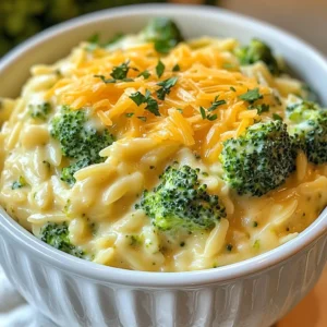 - 1 cup orzo pasta - 2 cups broccoli florets - 1 cup shredded sharp cheddar cheese - 1 tablespoon olive oil - 1 small onion, finely chopped - 2 cloves garlic, minced - 4 cups vegetable broth - 1/2 cup heavy cream - 1/4 teaspoon nutmeg - Salt and pepper to taste - 2 tablespoons grated Parmesan cheese - Fresh parsley for garnish In this creamy broccoli cheddar orzo recipe, I focus on fresh, simple ingredients. The orzo pasta gives a nice texture that pairs well with the cheese and broccoli. You can pick any broccoli florets. The sharp cheddar cheese adds a rich flavor that makes this dish special. For the additional ingredients, I use olive oil and butter for a great base. The onion and garlic create a lovely aroma as they cook. The vegetable broth helps to build the sauce. Heavy cream adds a rich creaminess that brings it all together. A hint of nutmeg rounds out the flavors, making it warm and inviting. If you want to take it up a notch, try the optional add-ins. Grated Parmesan cheese adds a salty kick. Fresh parsley makes a bright garnish that looks nice on your plate. This dish is not only tasty but also colorful and fun to serve. Enjoy making this delightful meal! {{ingredient_image_1}} 1. Start by boiling a large pot of salted water. The water should taste a bit like the sea. 2. Add 1 cup of orzo pasta to the boiling water. Cook it for about 8-10 minutes. Check the package for exact times. 3. With 2-3 minutes left, add 2 cups of broccoli florets to the pot. This helps the broccoli cook just right. 4. Once done, drain the orzo and broccoli in a colander. Set them aside. 1. In the same pot, heat 1 tablespoon of olive oil over medium heat. 2. Add 1 small onion, finely chopped. Sauté for about 3-4 minutes until it turns soft and clear. 3. Stir in 2 cloves of minced garlic. Cook for another minute until it smells great. 1. Increase the heat to medium-high. Pour in 4 cups of vegetable broth. Bring it to a boil. 2. Reduce the heat and let it simmer for about 5 minutes. This helps the flavors mix. 3. Stir in 1/2 cup of heavy cream and 1/4 teaspoon of nutmeg. Let it simmer for 2-3 more minutes. 4. Gradually add in 1 cup of shredded sharp cheddar cheese. Stir until it melts and becomes creamy. 5. Add the cooked orzo and broccoli back into the pot. Mix everything gently until well coated. 6. Season with salt and pepper to taste. If you want, sprinkle in 2 tablespoons of grated Parmesan cheese. Mix again. To get that perfect creamy texture, add cheese slowly. If you dump it all at once, the cheese can clump. Let it melt gradually for a smooth sauce. Heavy cream also plays a key role here. It adds richness and helps bind everything together. This makes the dish velvety and delicious. To boost the flavor, try adding a pinch of red pepper flakes or a dash of garlic powder. These spices give a nice kick without overpowering the dish. Fresh herbs like thyme or basil also work well. Always taste your dish as you go. Adjust the salt and pepper to your liking. This small step can really make a big difference. For a beautiful presentation, serve the orzo in deep white bowls. This contrast really makes the colors pop. Top each bowl with extra cheddar cheese and freshly chopped parsley. These simple touches make your meal look gourmet. You can also sprinkle a bit of grated Parmesan on top for added flavor. Enjoy your lovely meal! Pro Tips Use Fresh Broccoli: Fresh broccoli adds vibrant color and a crunchy texture to your dish. Avoid overcooking to maintain its bright green hue and nutritional value. Cheese Selection: For a sharper flavor, opt for aged cheddar cheese. Mixing different types of cheese can also enhance the creaminess and taste. Perfectly Cooked Orzo: Be sure to cook the orzo until it's al dente. It will continue to absorb liquid and soften after mixing with the sauce. Garnish for Flair: Fresh parsley not only adds a pop of color but also a fresh flavor that balances the richness of the cheese and cream. {{image_2}} You can make this dish even better by swapping cheese types. Try using gouda or mozzarella for a different taste. These cheeses melt well and add unique flavors. Adding more vegetables boosts nutrition and color. Consider bell peppers, spinach, or peas. These veggies mix in smoothly and add crunch. To make this dish heartier, incorporate chicken or shrimp. Cook the protein separately and mix it in before serving. This addition gives you extra protein and makes the meal more filling. If you prefer plant-based options, try adding chickpeas or tofu. These options are great for plant lovers and taste delicious. If you need a gluten-free meal, use gluten-free orzo. Many brands offer great alternatives that taste just as good. For creaminess, explore alternative sauces. Use coconut cream or cashew cream for a rich flavor. These options keep the dish creamy without gluten. To store your creamy broccoli cheddar orzo, let it cool first. Then, place it in an airtight container. This keeps it fresh and tasty. You can safely store it in the fridge for up to three days. Make sure to label the container with the date for easy tracking. For reheating, use the stovetop for the best results. Place the orzo in a pan over low heat. Add a splash of vegetable broth or cream to keep it creamy. Stir gently as it warms up. If you prefer the microwave, use a microwave-safe bowl. Heat it in short bursts, stirring in between, and add liquid as needed. You can freeze creamy broccoli cheddar orzo if you want to save some for later. Allow it to cool completely, then scoop it into freezer-safe bags or containers. Remove as much air as possible. It can last in the freezer for up to three months. When you're ready to enjoy it, thaw it in the fridge overnight. Reheat as explained above to keep that creamy texture. This way, you can savor your delightful meal anytime! You can use several pasta types instead of orzo. Good options are: - Ditalini - Acini di pepe - Small shells When using these pasta types, adjust the cooking time. Check the package for the right time to cook. The goal is to keep it al dente. Yes, you can make this dish ahead of time. Prepare it up to the mixing stage. Store it in the fridge for up to three days. Use an airtight container for best results. To reheat, warm it on the stove over low heat. Add a splash of broth or cream to keep it creamy. Stir often to avoid sticking. You can make a dairy-free version easily. Use plant-based milk instead of heavy cream. Look for unsweetened options like almond or oat milk. For cheese, try a vegan cheddar or nutritional yeast. Both will add flavor without dairy. Adjust your seasonings to taste for the best results. You learned how to create a creamy broccoli cheddar orzo dish. We covered important ingredients, step-by-step instructions, and useful tips. You can explore variations based on your diet, from vegetarian to gluten-free options. Remember to store leftovers properly to enjoy them later. This meal is simple and flexible, allowing for creativity. I hope you feel ready to make this tasty dish at home. Enjoy every bite and share your experience!