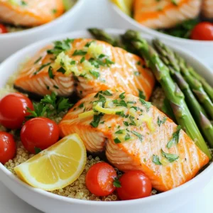 - 4 salmon fillets (6 oz each) - 2 tablespoons olive oil - 2 lemons (1 zested and juiced, 1 sliced) - 3 cloves garlic, minced - 1 teaspoon dried oregano - 1 teaspoon dried thyme - 1 teaspoon paprika - Salt and pepper to taste - 1 cup cherry tomatoes, halved - 1 cup asparagus, trimmed and cut into 2-inch pieces The star of this dish is the salmon. It is rich in omega-3 fatty acids and has a lovely flavor. I like to use good quality salmon fillets. The olive oil adds healthy fat and helps the seasonings stick. The lemon zest and juice bring bright, fresh flavor. Garlic gives a nice depth, while the oregano and thyme add warmth. Paprika gives a subtle smokiness. You can easily adjust the salt and pepper to fit your taste. The vegetables add color and nutrition. I use cherry tomatoes and asparagus here. They roast well and add a burst of flavor. You can swap these for any veggies you like, such as bell peppers or zucchini. For this recipe, I recommend using white or red quinoa. Both types cook well and have a nice texture. Quinoa is a great source of protein and fiber. You can cook quinoa in water, but I prefer using vegetable broth. It adds extra flavor to the dish. You can also use chicken broth for a richer taste. - Fresh parsley, chopped (for garnish) - Lemon slices Garnishes make your dish pop. Fresh parsley adds a bright note and color. It makes the meal look fresh and inviting. Lemon slices add visual appeal and extra zing. You can squeeze them over the salmon for more flavor. Adding these simple touches elevates your meal. First, preheat your oven to 400°F (200°C). This step is key for even cooking. While the oven heats, grab a large sheet pan. Line it with parchment paper. This helps with easy cleanup and prevents sticking. In a mixing bowl, combine these ingredients: - 2 tablespoons olive oil - Zest of 1 lemon - Juice of 1 lemon - 3 minced garlic cloves - 1 teaspoon dried oregano - 1 teaspoon dried thyme - 1 teaspoon paprika - Salt and pepper to taste Mix well to create a flavorful marinade. Marinating adds depth and makes the salmon tender. Let it sit while you prepare the rest. Now, take the salmon fillets and coat them with the marinade. Save a tablespoon for later. Place the fillets skin-side down on the prepared sheet pan. Next, take the cherry tomatoes and asparagus. Toss them in the reserved marinade and spread them around the salmon. Don’t forget to add lemon slices on top for extra flavor. Bake everything in the oven for 15-20 minutes. The salmon should be cooked through and flake easily with a fork. Keep an eye on it to avoid overcooking. While the salmon bakes, rinse 2 cups of quinoa under cold water. This removes bitterness. In a medium saucepan, combine the rinsed quinoa and 4 cups of vegetable broth. Bring it to a boil, then reduce to a simmer. Cover and cook until the quinoa is fluffy and all liquid is absorbed, about 15 minutes. Once the salmon and veggies are ready, it’s time to assemble your bowls. Start with a base of quinoa. Top it with the salmon fillets and roasted vegetables. Add fresh parsley for a pop of color. Drizzle any leftover marinade on top for added flavor. Enjoy your meal! To make a great marinade, you can adjust flavors to fit your taste. If you want more zing, add extra lemon juice or zest. For a richer flavor, try adding more olive oil. You can also play with herbs. Fresh herbs will add a bright taste. Marination time is key. I suggest marinating the salmon for at least 30 minutes. This gives the fish a chance to soak up all the flavors. If you have time, marinate it for up to two hours in the fridge. This helps the flavors really stick. While sheet pan cooking is easy, you can try other methods too. Grilling the salmon gives it a smoky flavor. You can also bake it in a dish with a lid to keep it moist. If you need a quick meal, pan-searing is fast and tasty. To get flaky salmon, don’t overcook it. The fish should be pink in the center when done. A good rule is to cook it for 4-6 minutes per half inch of thickness. Use a fork to test if it flakes easily. If it does, it’s ready! When serving your bowls, think about pairings. A side salad with lemon vinaigrette adds crunch and fresh taste. You might also enjoy some crusty bread to soak up extra juices. For portion control, aim for balanced bowls. Start with a base of quinoa, then add equal parts salmon and veggies. Keep an eye on your serving sizes. This way, you won’t feel too full and can enjoy every bite! {{image_2}} You can easily swap out the salmon. Try using cod, trout, or halibut. Each fish brings its unique flavor. If you want to go plant-based, use tofu or tempeh instead. These options are great for a vegan twist. For vegetables, you can switch asparagus and tomatoes. Broccoli, zucchini, or bell peppers work well too. Choose what you like best. Mix and match to create your ideal bowl. Herbs and spices can change the flavor of your dish. Try fresh dill or basil instead of dried herbs. They add freshness and brightness. You can also explore spices like cumin or coriander for a different taste. If you want some heat, sprinkle chili flakes over the salmon. This adds a nice kick without overpowering the dish. You can adjust the amount to suit your taste. For gluten-free options, make sure to use gluten-free quinoa. Quinoa is naturally gluten-free and a great base for this dish. Check that your broth is also gluten-free to keep everything safe. If you’re looking for vegan variations, replace the salmon with plant-based protein. Tofu or chickpeas are fantastic choices. You can also skip the chicken broth and use water or vegetable broth instead. This way, everyone can enjoy a delicious meal. To keep leftover salmon bowls fresh, use airtight containers. Place the bowls in the fridge right away. This helps to keep the flavors intact. Enjoy your leftovers within 2-3 days. If you see any signs of spoilage, like an off smell or discoloration, it’s best to toss it. When you reheat salmon bowls, you want to keep the salmon juicy. The best method is to use the oven. Preheat it to 350°F (175°C) and bake for about 10 minutes. You can also use the microwave for a quick option. Heat in short bursts, about 30 seconds at a time, to avoid overcooking. To freeze your salmon bowls, let everything cool completely first. Use freezer-safe containers. This way, the flavors stay good for up to 3 months. When you’re ready to eat, take them out to thaw in the fridge overnight. Freezing may change the texture of the salmon, but it will still taste great. You can serve many tasty sides with these salmon bowls. Here are some ideas: - Steamed broccoli for a green crunch - A fresh garden salad for added veggies - Roasted sweet potatoes for a sweet touch - A light yogurt sauce for creaminess These sides will complement the flavors of the salmon well. To check if the salmon is done, use a fork. Gently press down on the thickest part of the fillet. If it flakes easily, it is ready. The internal temperature should reach 145°F. If you don’t have a thermometer, look for a pink, opaque color. Yes, you can use fresh herbs! They add a bright taste. Here are some good swaps: - Use 1 tablespoon of fresh oregano instead of 1 teaspoon dried - Use 1 tablespoon of fresh thyme instead of 1 teaspoon dried Just remember, fresh herbs have a stronger taste, so adjust to your liking. You can store leftovers in the fridge for up to 3 days. Make sure to place them in an airtight container. Keep an eye out for any off smells or changes in texture to ensure they are still good to eat. Yes, you can prepare some parts ahead of time. Marinate the salmon a few hours before cooking, or the night before. You can also cook the quinoa in advance and store it in the fridge. Just reheat everything when you are ready to serve. This guide covers making delicious Sheet Pan Lemon Herb Salmon Bowls. You start with fresh salmon, veggies, and flavorful quinoa. The marinade is key to great taste, so don't skip it. You learned tips for cooking, serving, and storing. Feel free to swap ingredients for your taste. Try this recipe for a healthy meal that is quick to prepare. You'll enjoy the flavors and the ease of cooking. Make it your own and share with friends!