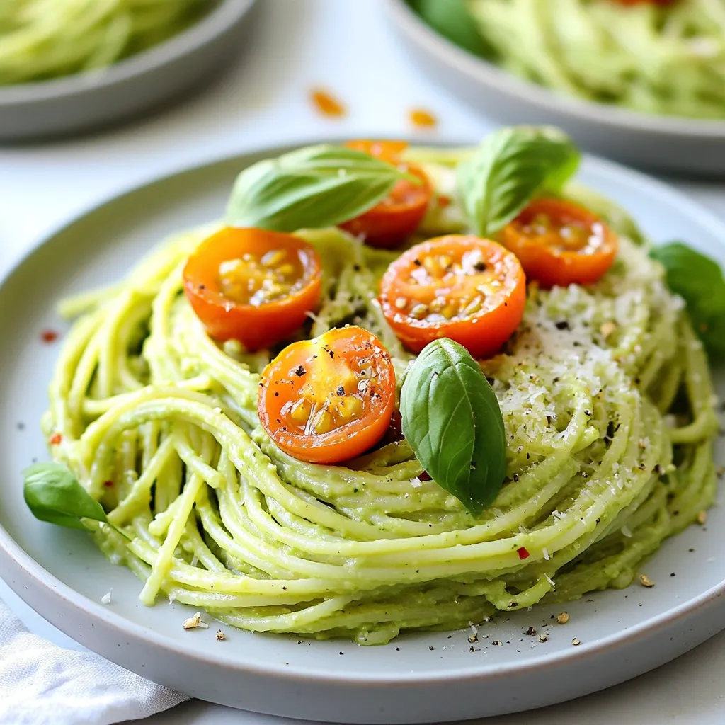 To make creamy avocado pasta, gather these key items: - 12 oz spaghetti or your favorite pasta - 2 ripe avocados, pitted and peeled - 2 cloves garlic, minced - 2 tablespoons lemon juice - 1/4 cup fresh basil leaves - 1/4 cup grated Parmesan cheese (or nutritional yeast for a vegan option) - 1/4 cup olive oil - Salt and pepper to taste These ingredients blend to form a rich, creamy sauce. The avocados give the dish its smooth texture. Basil adds a fresh flavor, while the garlic gives it a lovely kick. You can also mix in these optional ingredients to change the taste: - Crushed red pepper flakes for heat - Spinach or kale for extra greens - Sun-dried tomatoes for a tangy touch - Chicken or shrimp for added protein These options make your creamy avocado pasta more unique. Feel free to play with flavors and textures! To finish your dish, consider these garnishes: - Halved cherry tomatoes for color and sweetness - A sprinkle of crushed red pepper flakes for spice - Extra basil leaves for a fresh touch Garnishes not only enhance the look of your dish but also add more flavor. They make your creamy avocado pasta even more inviting! {{ingredient_image_1}} To start, fill a large pot with water. Add salt and bring it to a boil. Once boiling, add 12 ounces of your favorite pasta, like spaghetti. Cook the pasta according to the package instructions until it is al dente. This usually takes around 8 to 10 minutes. When done, reserve half a cup of the pasta water. Then, drain the pasta and set it aside. Next, grab a food processor. Add 2 ripe avocados, pitted and peeled. Then, toss in 2 minced garlic cloves, 2 tablespoons of lemon juice, and 1/4 cup of fresh basil leaves. Add 1/4 cup of grated Parmesan cheese for flavor. Blend all these ingredients until you have a smooth and creamy sauce. If the sauce is too thick, add a bit of the reserved pasta water. Blend again until you reach your desired consistency. Now, take a large mixing bowl. Add the drained pasta to the bowl. Pour the creamy avocado sauce over the pasta. Toss everything together until the pasta is nicely coated. If it looks dry, add more of the reserved pasta water slowly. Season with salt and pepper to taste. You can also adjust the lemon juice or add more herbs for extra flavor. Finally, plate the pasta and garnish with halved cherry tomatoes and a sprinkle of crushed red pepper flakes if you like some heat. Enjoy your creamy avocado pasta! When picking avocados, look for ripe ones. A ripe avocado feels slightly soft when you press it. Avoid ones that are too mushy or have dark spots. If you can’t find ripe avocados, buy hard ones. Let them ripen at room temperature for a few days. Check them daily for ripeness. To get a creamy texture, blend the avocado well. Use a food processor for the best mix. If your sauce is too thick, add a little reserved pasta water. This helps you reach the perfect creaminess. Mixing in fresh basil gives the sauce a smooth feel. Add more flavor by mixing in herbs or spices. Fresh herbs like parsley or cilantro work well. You can also try a pinch of crushed red pepper for heat. For a zesty kick, add more lemon juice. Finally, try different cheeses like feta or goat cheese for a unique twist. Pro Tips Choose Ripe Avocados: Make sure your avocados are perfectly ripe for the creamiest texture. They should yield slightly to gentle pressure. Adjusting Creaminess: If your avocado sauce is too thick, gradually add the reserved pasta water until you reach the desired creamy consistency. Fresh Herbs Matter: Using fresh basil will elevate the flavor of the dish. Dried herbs can work in a pinch, but fresh is always best! Garnish for Color: Adding cherry tomatoes not only gives a pop of color but also a burst of freshness that complements the richness of the avocado sauce. {{image_2}} You can easily make this dish vegan. Instead of Parmesan cheese, use nutritional yeast. It adds a cheesy flavor while keeping the dish plant-based. Simply replace the cheese in the recipe with 1/4 cup of nutritional yeast. This swap keeps your creamy avocado pasta rich and tasty. Feel free to switch up the pasta. While spaghetti works great, you can use any pasta you like. Try whole wheat, gluten-free, or even zucchini noodles for a lighter option. Just remember to cook them according to the package directions. This way, you can enjoy your creamy avocado pasta in different forms. Boost the nutrition of your creamy avocado pasta by adding proteins or veggies. Cooked chicken, shrimp, or chickpeas pair well. You could also toss in spinach, peas, or bell peppers for color and crunch. Add these extras when you mix the pasta with the sauce. This makes your meal even more filling and delicious. To store leftover creamy avocado pasta, place it in a clean, airtight container. Make sure to cover it well to keep out air. This will help keep the flavors fresh. You can store it in the fridge for up to two days. If you plan to eat it later, try to add a bit more lemon juice. This helps slow down browning. When you reheat your creamy avocado pasta, do it gently. I recommend using a pan on low heat. Add a splash of reserved pasta water to help loosen the sauce. Stir often to keep the creamy texture. You can also microwave it, but do so in short bursts. Check every 30 seconds to avoid overheating. For storing your pasta, use glass or BPA-free plastic containers. They keep food fresh and are easy to clean. Choose a container that seals tightly. This will prevent air from getting in and spoiling your dish. If you want to freeze it, use freezer-safe bags. Make sure to remove as much air as possible before sealing. Yes, you can make the avocado sauce ahead of time. Just blend the sauce as directed. Then, store it in an airtight container. To keep it fresh, add some extra lemon juice on top. This will help slow down browning. When you are ready to eat, just mix it with the cooked pasta. If you want a substitute for Parmesan cheese, try nutritional yeast. It adds a cheesy flavor without dairy. You can also use pecorino cheese for a different taste. If you want a nut-free option, try a bit of ground cashews. This will keep the dish creamy and tasty. To stop avocados from browning, use a bit of lemon juice. This acid slows down the oxidation process. Make sure to cover the sauce tightly when storing it. You can also press plastic wrap directly onto the surface. This will limit air exposure and keep the green color. Making creamy avocado pasta is simple and fun. We covered the best ingredients, from essential items to garnishes. You learned step-by-step how to cook the pasta and make the sauce. Tips on choosing avocados and keeping the dish creamy help you perfect your meal. We also looked at tasty variations and smart storage methods. Finally, I answered your common questions. Enjoy making this dish your own. It's a quick, healthy option for any meal!