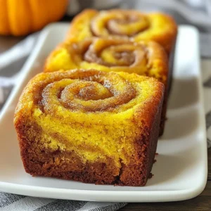 - 1 ½ cups all-purpose flour - 1 teaspoon baking powder - 1 teaspoon baking soda - ½ teaspoon salt - 1 teaspoon ground cinnamon - ½ teaspoon ground nutmeg - 1 cup canned pumpkin puree - ½ cup granulated sugar - ½ cup brown sugar, packed - ½ cup vegetable oil - 2 large eggs - 1 teaspoon vanilla extract - 2 tablespoons brown sugar - 1 teaspoon ground cinnamon For this mini pumpkin bread, the right balance of flavors is key. The dry ingredients create structure. The wet ingredients bring moisture and sweetness. The cinnamon swirl adds a delightful touch. Gather all your dry ingredients first. Mix the flour, baking powder, baking soda, salt, and spices in a bowl. I love using fresh spices for better flavor. The scent of cinnamon and nutmeg fills the kitchen. It gets you excited for baking! Next, focus on the wet ingredients. The canned pumpkin puree is creamy and rich. It provides moisture and a lovely orange hue. Combine the pumpkin with both sugars, oil, eggs, and vanilla in a large bowl. Mix until smooth. You’ll know it’s ready when there are no lumps. Now, for that special cinnamon swirl! In a small bowl, mix the brown sugar with ground cinnamon. This mixture will create a sweet ribbon of flavor in your bread. Remember, the right ingredients make all the difference. Each step builds flavor and texture. Prepare yourself for a cozy baking experience with this delightful mini pumpkin bread! {{ingredient_image_1}} First, preheat your oven to 350°F (175°C). This step warms up the oven, so the bread bakes evenly. Next, grease your mini loaf pan with a bit of oil or butter. You can also line it with parchment paper for easier removal later. In a medium bowl, whisk together the dry ingredients. Combine 1 ½ cups of all-purpose flour, 1 teaspoon of baking powder, 1 teaspoon of baking soda, ½ teaspoon of salt, 1 teaspoon of ground cinnamon, and ½ teaspoon of ground nutmeg. Whisk until everything blends well. This mix adds flavor and helps the bread rise. In a large bowl, you will mix the wet ingredients. Start by adding 1 cup of canned pumpkin puree. Then, add ½ cup of granulated sugar, ½ cup of packed brown sugar, ½ cup of vegetable oil, 2 large eggs, and 1 teaspoon of vanilla extract. Stir until the mixture is smooth and creamy. Now, it's time to combine the wet and dry mixtures. Gradually add the dry mix to the wet mix, stirring gently. Be careful not to overmix; it’s okay to have a few lumps. This step keeps the bread light and fluffy. In a small bowl, mix 2 tablespoons of brown sugar and 1 teaspoon of ground cinnamon to make the cinnamon swirl. Pour half of the pumpkin bread batter into your prepared pan. Then, sprinkle half of the cinnamon mixture over the batter. Use a knife to gently swirl the cinnamon into the batter, creating a lovely pattern. Pour the rest of the pumpkin batter on top of the first swirl. Add the remaining cinnamon mixture and swirl it again with the knife. Place the pan in the preheated oven. Bake for 25-30 minutes. To check for doneness, insert a toothpick in the center. If it comes out clean, your bread is ready. Let it cool in the pan for about 10 minutes before moving it to a wire rack for full cooling. To make a great swirl, mix the cinnamon and sugar well. Use a small bowl for this. When you pour the batter, do it slowly. Start with half the batter in the pan. Then, sprinkle half of the swirl mix on top. Use a knife to gently swirl it. Don’t mix too hard; you want to see the swirl. Pour the rest of the batter and repeat the process. This makes a pretty pattern and adds great flavor. One big mistake is overmixing your batter. Mix just until combined. A few lumps are okay. If you mix too much, the bread can be tough. To check for doneness, use a toothpick. Insert it in the center. If it comes out clean, your bread is ready. If it has wet batter, bake a few more minutes. Keep an eye on it so it doesn’t burn. You can add extras to boost flavor. Chopped nuts, like walnuts or pecans, add crunch. Chocolate chips bring a sweet touch. You can mix these in with your wet ingredients. Just remember to adjust your baking time if you add a lot. Adding too many extras can make the bread dense. Keep it balanced for the best taste. Pro Tips Use Fresh Spices: For the best flavor, use fresh ground cinnamon and nutmeg rather than pre-ground spices. This will enhance the taste of your pumpkin bread significantly. Check for Doneness: Always test your bread with a toothpick or cake tester before removing it from the oven. It should come out clean or with a few moist crumbs, not wet batter. Let It Cool: Allow the mini loaves to cool in the pan for 10 minutes before transferring to a wire rack. This helps prevent them from breaking apart. Store Properly: To keep your pumpkin bread fresh, wrap it tightly in plastic wrap or store it in an airtight container. It can last for several days at room temperature or longer in the refrigerator. {{image_2}} You can easily change the taste of your mini pumpkin bread. For a classic twist, add pumpkin spice. Just mix in a teaspoon of pumpkin spice blend with your dry ingredients. If you love chocolate, fold in half a cup of chocolate chips into the batter. This will make every bite rich and sweet. You can also try nuts like walnuts or pecans. These add a nice crunch and flavor boost. If you need gluten-free options, swap regular flour for a gluten-free blend. Many brands work well in baking. For sugar substitutes, try using coconut sugar or agave syrup. Both will sweeten your bread without using regular sugar. You can also reduce the sugar by a quarter cup if you prefer a less sweet bread. For extra fun, top your mini bread with icing. A simple cream cheese icing pairs well. Just mix cream cheese, powdered sugar, and a splash of vanilla. Drizzle it over the cooled bread for a tasty finish. You can also sprinkle some chopped nuts on top for added texture. Another idea is to serve it with a dollop of whipped cream or a scoop of ice cream. These add-ons make your mini pumpkin bread even more delightful. First, let your mini pumpkin bread cool. After baking, leave it in the pan for about 10 minutes. Then, transfer it to a wire rack. Cooling helps prevent sogginess. Make sure it cools completely before storing. If you skip this step, moisture can build up and ruin your loaf. For storage, use an airtight container. This keeps the bread fresh and moist. You can also wrap it tightly in plastic wrap or foil. Store it at room temperature if you plan to eat it within a few days. For longer storage, place it in the fridge. This helps it last longer, but it may dry out a bit. To freeze your mini pumpkin bread, first let it cool completely. Wrap each loaf tightly in plastic wrap. Then, place it in a freezer bag. Make sure to squeeze out as much air as you can. It will stay fresh for about three months. When you are ready to eat, take it out and let it thaw in the fridge overnight. If you want it warm, you can heat it in the oven at 350°F for about 10 minutes. Enjoy the sweet smell of fresh-baked bread again! Yes, you can use fresh pumpkin. Start by roasting a small pumpkin. Cut it in half, scoop out the seeds, and place it cut-side down on a baking sheet. Roast it at 350°F for about 45 minutes or until soft. Once cool, scoop out the flesh and mash it. This fresh pumpkin will need some extra time to prepare, but it adds a great taste. Look for a few signs. First, the top should be golden brown. Second, use a toothpick. Insert it into the center of the bread. If it comes out clean, your bread is done. Another sign is a slight spring when you touch the top. If it feels firm and springs back, it is ready. Mini pumpkin bread pairs well with many tasty options. Try spreading cream cheese or butter on a warm slice. You can also enjoy it with a hot drink. A spiced chai or a pumpkin latte makes a perfect match. These pairings enhance the flavor and make for a cozy treat. When stored correctly, mini pumpkin bread can last a week. If you keep it in a sealed container, it stays fresh for about 4-5 days. For longer storage, freeze it. It can last up to 3 months in the freezer. Just remember to wrap it tightly in plastic wrap first. You now have a complete guide to making delicious mini pumpkin bread. You learned about ingredients, including dry and wet parts, and the special cinnamon swirl mixture. I shared easy steps for preparing, mixing, and baking. The tips helped you avoid common mistakes and suggested tasty variations. Finally, I detailed storage methods for keeping your bread fresh. With this knowledge, you're ready to bake confidently. Enjoy the warm scents and great flavors of your mini pumpkin bread. Happy baking!