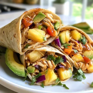 - 2 cups cooked chicken, shredded - ½ cup Hawaiian BBQ sauce - 1 cup fresh pineapple, diced - 1 red bell pepper, thinly sliced - 1 cup shredded carrots - ½ cup red cabbage, finely shredded - 4 large whole wheat or spinach tortillas - ½ cup cilantro, chopped - 1 avocado, sliced - Salt and pepper to taste - Optional: lime wedges for garnish For Hawaiian BBQ chicken wraps, you need fresh, vibrant ingredients. Start with cooked chicken, which should be shredded. This gives the wrap a great texture. The Hawaiian BBQ sauce adds a sweet and tangy flavor. You can make your own or choose a jarred version. Next, pineapple is key! Fresh pineapple, diced small, brings a juicy burst. It pairs well with the chicken. The red bell pepper adds crunch and a pop of color. Slice it thin for easy wrapping. Shredded carrots give sweetness and more crunch. Red cabbage adds a nice touch too. It’s colorful and crunchy. You need whole wheat or spinach tortillas to hold everything together. They are healthy and tasty. Don’t forget the cilantro! It adds a fresh flavor. Sliced avocado is creamy and rich, making the wrap special. Lastly, season with salt and pepper. If you want a zesty kick, add lime wedges to serve. Gather these ingredients, and you’re ready to make a fun, tasty meal that everyone will love! {{ingredient_image_1}} Start by taking your cooked chicken. Shred it into small pieces. In a large bowl, mix the shredded chicken with Hawaiian BBQ sauce. Stir well so each piece of chicken gets coated in the sauce. This step adds a sweet and tangy flavor to your wraps. Next, grab a red bell pepper. Slice it thinly to create nice strips. Then, take your fresh pineapple and dice it into small chunks. In another bowl, mix the diced pineapple, sliced bell pepper, shredded carrots, and finely shredded red cabbage. Add a pinch of salt and pepper to taste. This mix adds crunch and freshness to the wraps. Now it’s time to build your wraps. Lay a tortilla flat on a clean surface. Spoon about half a cup of the BBQ chicken mixture into the center of the tortilla. Top it with a generous amount of the veggie mix. Add a few slices of avocado and a sprinkle of chopped cilantro for extra flavor. To wrap it, fold the bottom of the tortilla over the filling. Then fold in the sides and roll tightly. Repeat this for all the tortillas and filling. If you want some crispiness, grill the wraps. Heat a skillet over medium heat. Place the wraps on the skillet for 2 to 3 minutes on each side. This gives them a nice crunch. Once grilled, slice each wrap in half diagonally. Serve with lime wedges for a zesty touch. Enjoy your tasty Hawaiian BBQ chicken wraps! To make the best wraps, choose soft, large tortillas. Whole wheat or spinach tortillas work great. They hold the filling well and add flavor. When wrapping, be sure to fold the bottom up first. Then tuck in the sides tightly before rolling. This keeps everything inside. If you want a crispy finish, grill the wraps for a few minutes. They will taste even better! Add more flavor with extra toppings. Try adding sliced jalapeños for heat. You can also include cheese like Monterey Jack or feta. Fresh herbs like basil or mint give a nice twist. A squeeze of lime juice brightens the whole dish. Mix and match your favorites for a fun taste! Prep your ingredients ahead for quick meals. You can shred the chicken and mix it with BBQ sauce the night before. Chop the veggies and store them in a sealed container. This way, you can assemble the wraps in no time. If you plan to grill them, do it just before serving for the best taste. Enjoy the ease of a fast meal when you need it! Pro Tips Use Rotisserie Chicken: For a quicker prep time, consider using store-bought rotisserie chicken instead of cooking your own. This saves time and adds great flavor. Customize Your Veggies: Feel free to add or substitute any vegetables you like. Bell peppers, cucumbers, or even jalapeños can add a nice crunch and flavor. Grilling for Extra Flavor: Grilling the wraps not only warms them up but also adds a delicious smoky flavor. Make sure to brush the outside with a little olive oil before grilling. Make Ahead: You can prepare the chicken and vegetable mixtures ahead of time. Just store them separately in the fridge and assemble the wraps when you're ready to eat. {{image_2}} You can switch out chicken for tofu or shrimp. Tofu absorbs flavors well. Use firm tofu for the best texture. Simply cube and sauté it until golden. Toss it in the Hawaiian BBQ sauce, just like with chicken. Shrimp is another great choice. Cook shrimp until pink, then mix with the sauce. Both options give a tasty twist to your wraps. To make a fully vegetarian version, skip the chicken entirely. Load up your wraps with extra veggies. Try adding black beans for protein. They are rich in flavor and nutrients. You can also add sliced cucumbers or zucchini for crunch. This mix keeps the dish fresh and colorful. Don't forget to add a dash of lime juice for zing! Experiment with different BBQ sauces or spices to change the taste. You can try a spicy mango BBQ sauce for a fruity kick. Or go for a smoky chipotle sauce for some heat. Adding spices like cumin or paprika can also boost flavor. Have fun mixing and matching until you find your favorite! To keep your Hawaiian BBQ chicken wraps fresh, store them in the fridge. Wrap each one tightly in plastic wrap or foil. You can also place them in an airtight container. If you have unassembled wraps, store the chicken and veggies in separate containers. This way, the tortillas stay soft and fresh. When it’s time to enjoy your leftovers, reheat them carefully. The best way is to use a skillet. Heat it over medium heat and add the wrap. Cook for about 2-3 minutes on each side. This method keeps the texture nice and crispy. If you prefer the microwave, heat the wrap for 30 seconds, then check if it's warm enough. You can add more time if needed. Leftover wraps last about 3-4 days in the fridge. After that, the chicken and veggies may spoil. Always check for any off smells or changes in color before eating. If you want to keep them longer, consider freezing the wraps. They can stay in the freezer for up to three months. Just remember to wrap them tightly to avoid freezer burn. Yes, you can use store-bought BBQ sauce. Many brands offer great flavors. Homemade BBQ sauce can add a personal touch. You can adjust the sweetness and spice as you like. If you choose store-bought, look for one with natural ingredients. This can help you avoid extra additives. Always taste the sauce to see if you need to add anything. A splash of lime juice can brighten it up. If you're looking for a tortilla substitute, try lettuce wraps. They are fresh and low-carb. You can also use collard greens or rice paper for a fun twist. For gluten-free options, corn tortillas work well. They add a nice flavor too. If you prefer something with more fiber, try whole grain wraps. They keep the meal healthy and filling. Yes, you can freeze these wraps. Wrap them tightly in plastic wrap or foil. This keeps them fresh. When you want to eat them, thaw in the fridge overnight. Reheat them in a skillet or microwave. This makes the wraps warm and tasty again. However, avoid freezing with fresh toppings like avocado. They do not freeze well and can get mushy. You learned how to make tasty BBQ chicken wraps with fresh ingredients. We covered key steps like preparing the chicken, veggies, and how to assemble the wraps perfectly. I also shared tips for storage and fun variations. These wraps are easy and fun to make. They fit many diets and tastes. Enjoy experimenting with ingredients. You can create your own favorite version. Happy cooking!
